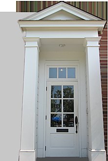 The columned front entrance of the Wolfe, McDuff & Oppie office